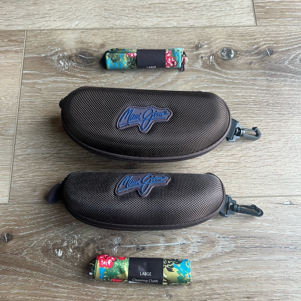 Two Maui Jim Sport Hard Cases.